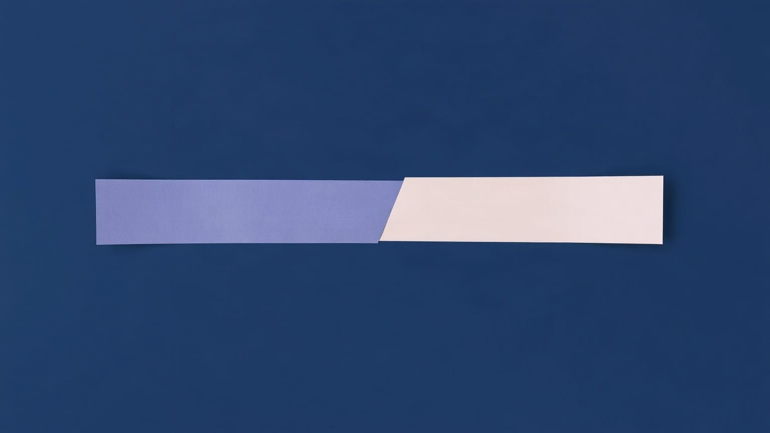 A long horizontal paper band crossing the frame, meeting a short vertical band at a right angle, with a small bridging shape laid over the join